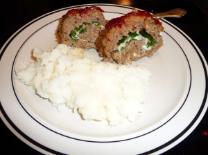 Meatloaf stuffed with spinach, mozzarella cheese, and fresh garlic